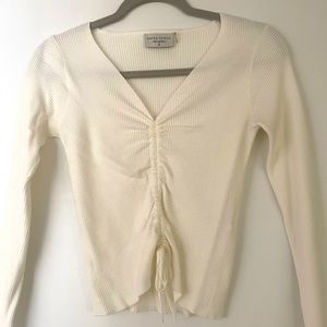 Long sleeve Dress Forum in creme colour with ruching in front and tie at bottom